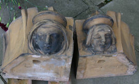 a pair of window stops with heads